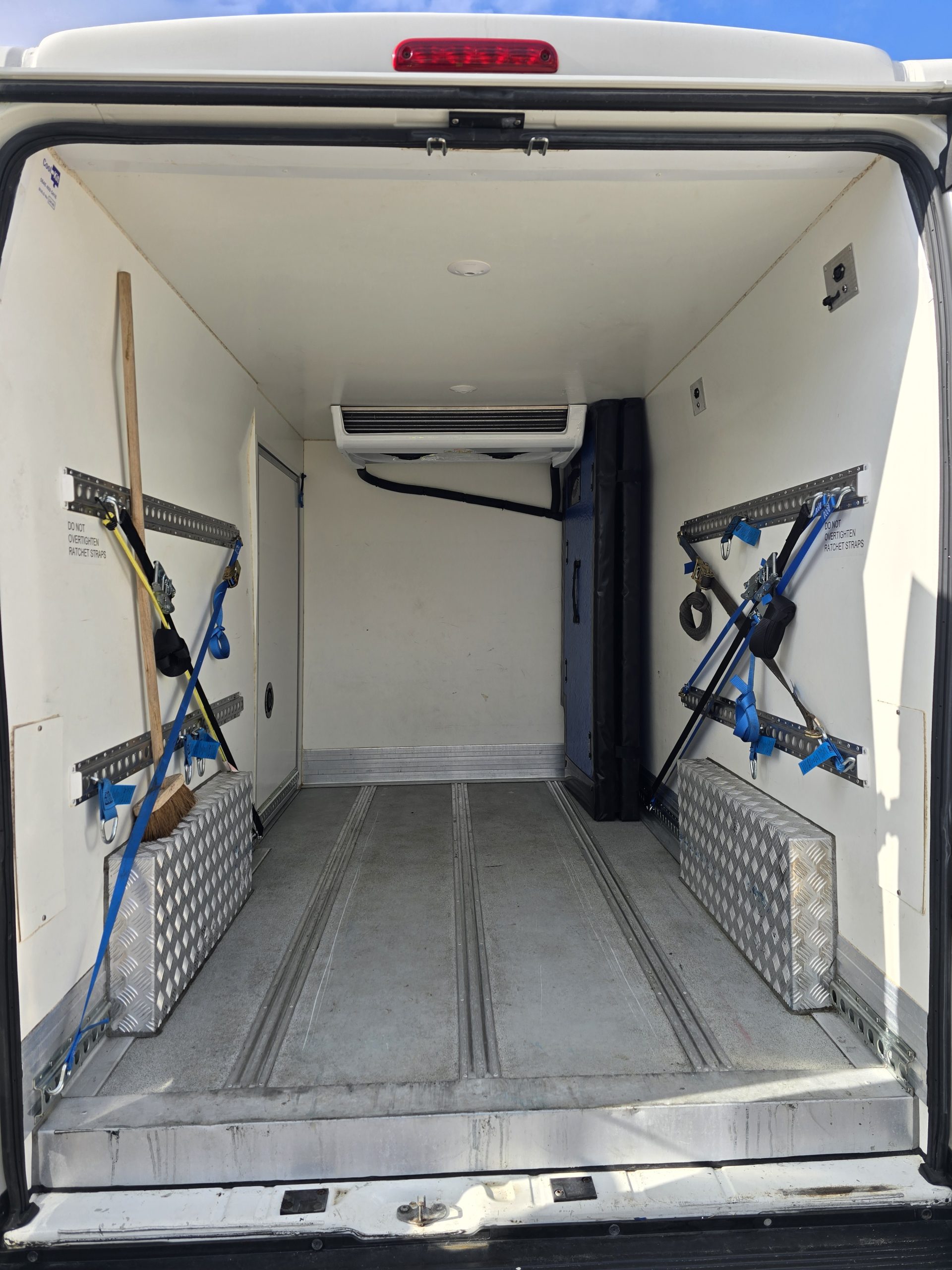 Dual temperature controlled van with securing straps and clean interior | Europa Xpress Ltd